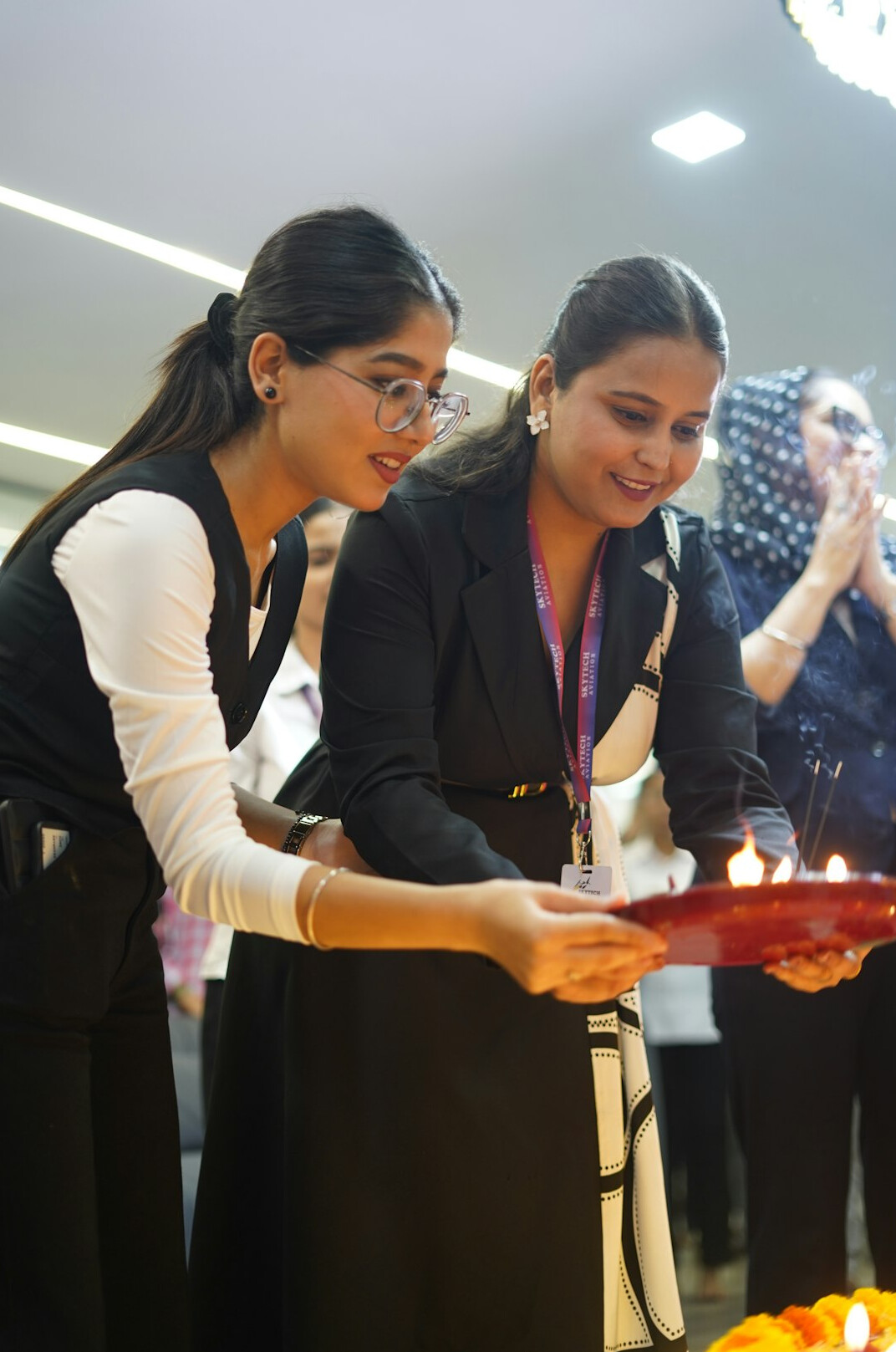 Two colleagues reviewing documents during a management handover