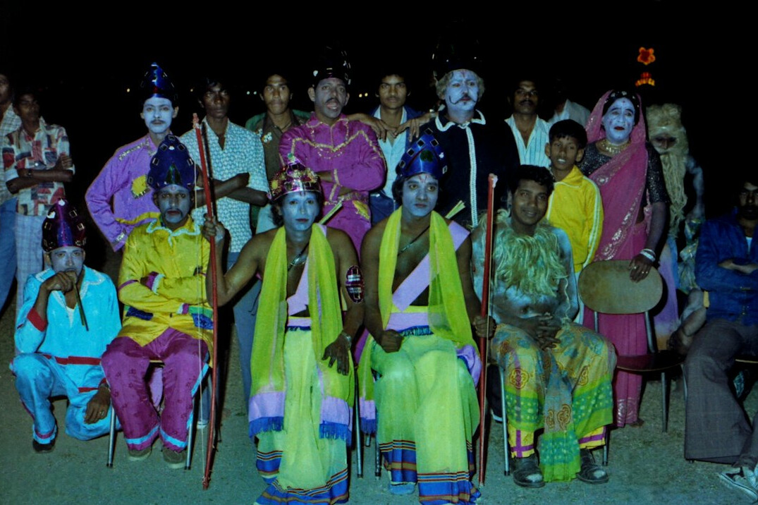 Team of facilitators standing together in an office